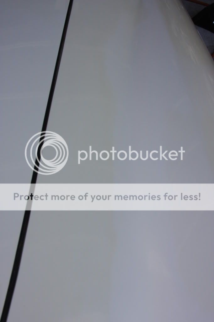 Large Yellow Stains on White Car